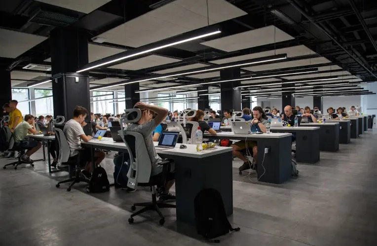 The Future of Enterprise Search: How AI Is Revolutionizing Information Retrieval 3 Employees working on enhancing user experience through natural language processing