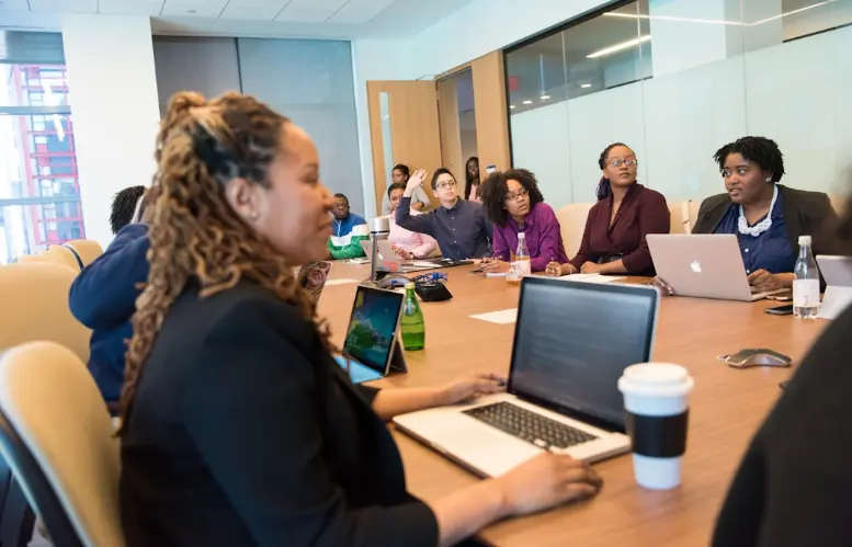 The Future of Enterprise Search: How AI Is Revolutionizing Information Retrieval 2 Team members discussing the integration of AI into enterprise search engines